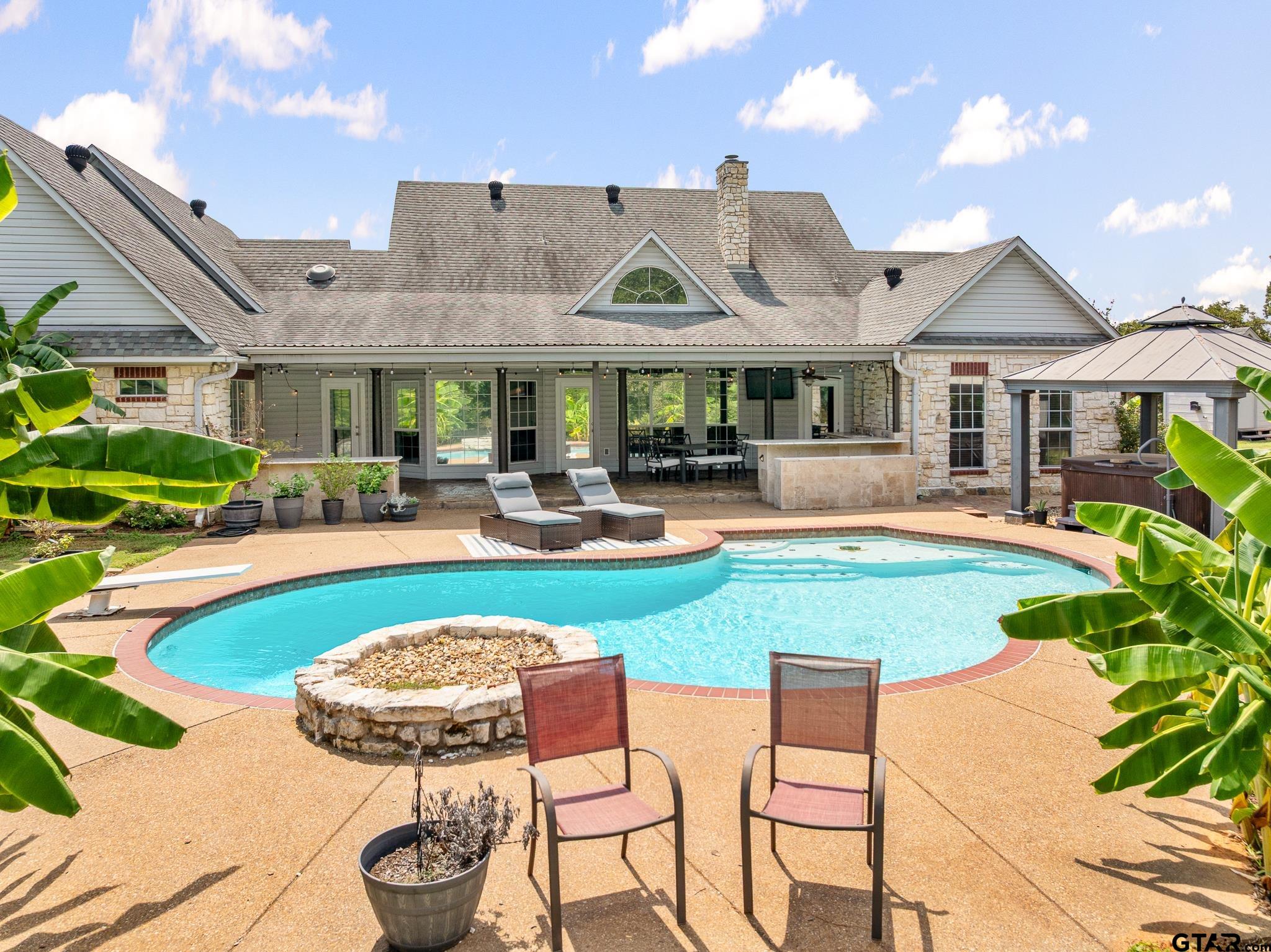 344 Antler Road Longview, TX 75605 - Photo 37 of 45 a view of a house with swimming pool and a yard