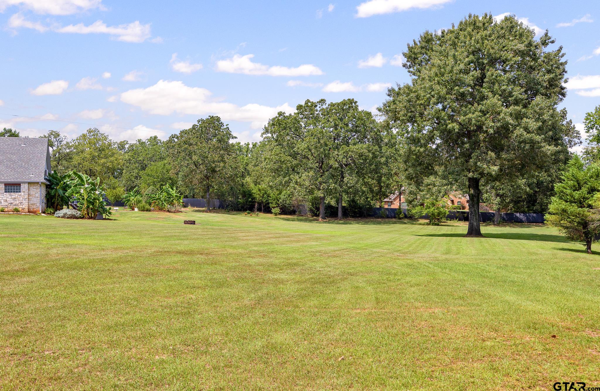 344 Antler Road Longview, TX 75605 - Photo 42 of 45 a view of a swimming pool with an outdoor space and seating area