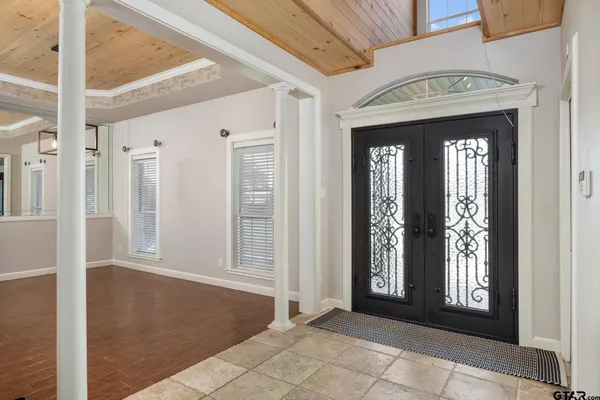 a spacious bedroom with a bed and a window
