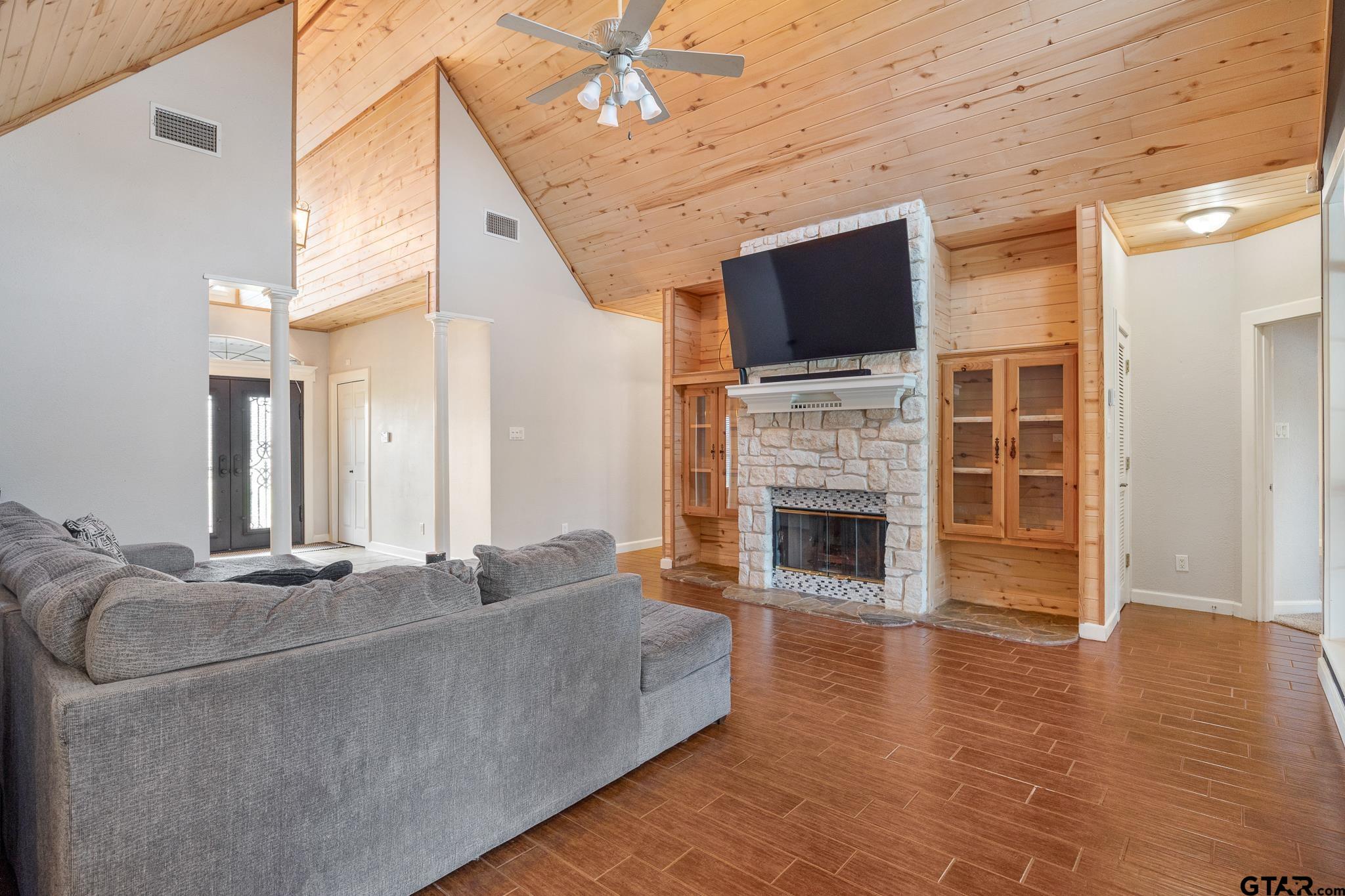 344 Antler Road Longview, TX 75605 - Photo 10 of 45 a living room with a flat screen tv and a fireplace