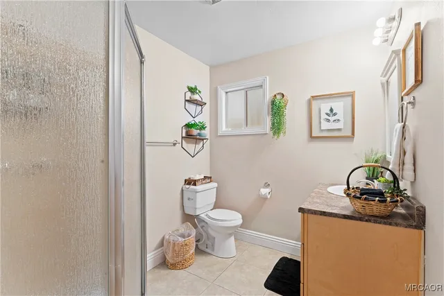 a bathroom with a toilet and a sink