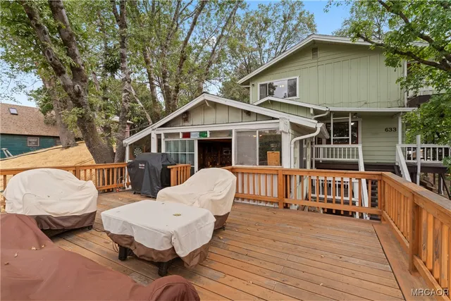 a front view of house with yard outdoor seating and green space