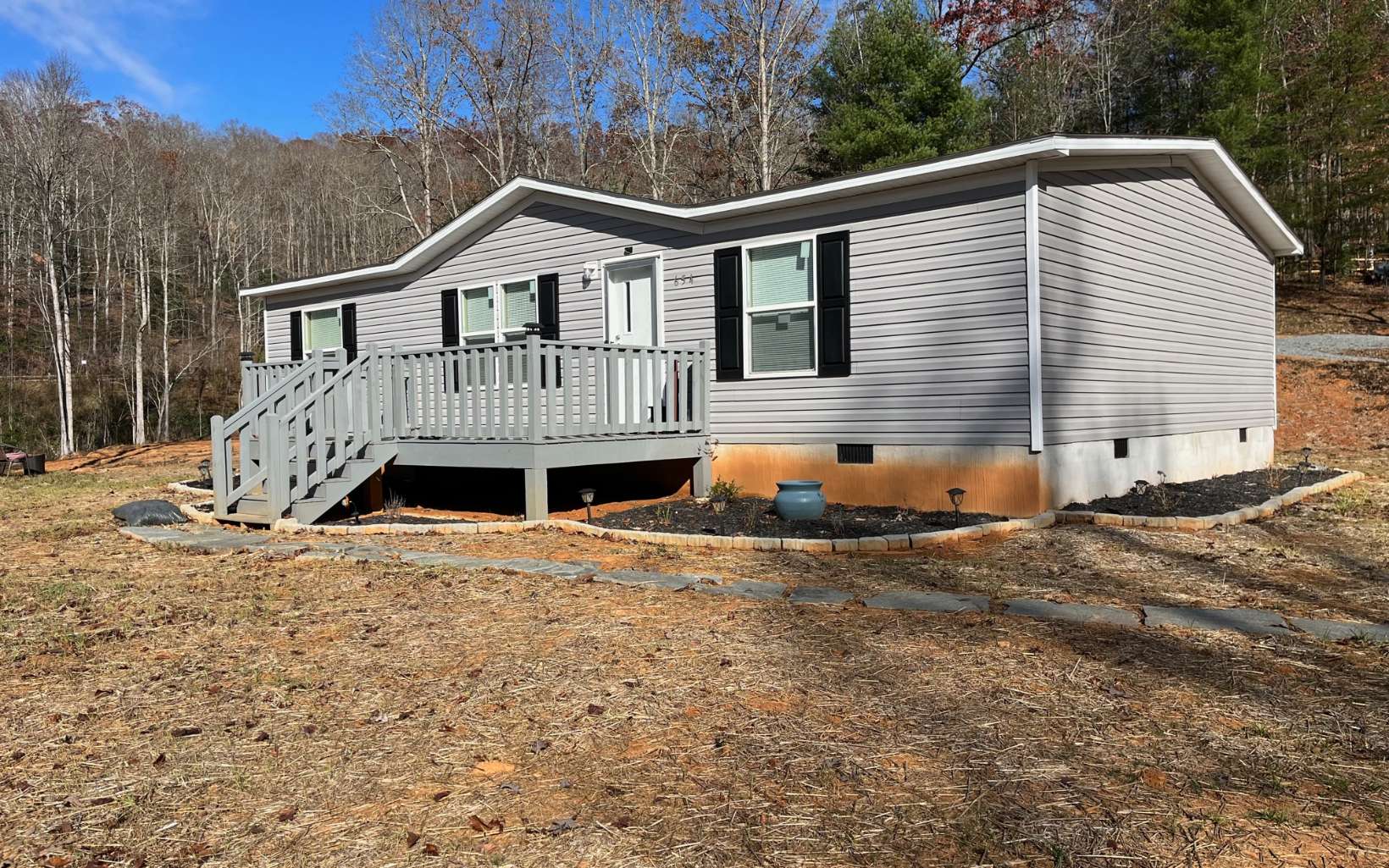 654 Burger Road Murphy, NC 28906 - Photo 1 of 33 a front view of a house with a yard and garage