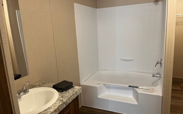 654 Burger Road Murphy, NC 28906 - Photo 14 of 33 a bathroom with a granite countertop sink and a mirror