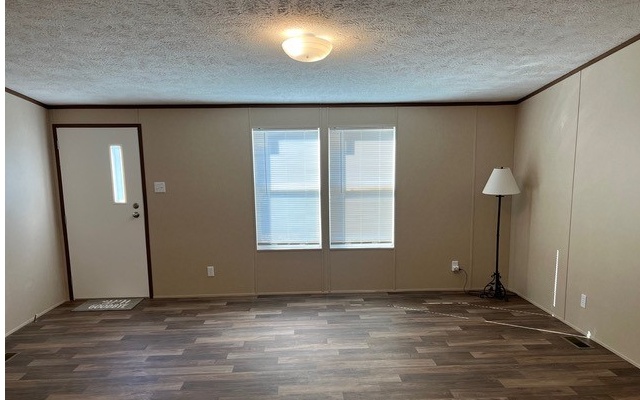 654 Burger Road Murphy, NC 28906 - Photo 17 of 33 an empty room with wooden floor and windows