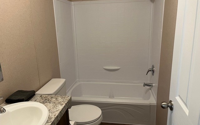 654 Burger Road Murphy, NC 28906 - Photo 21 of 33 a bathroom with a toilet and a tub