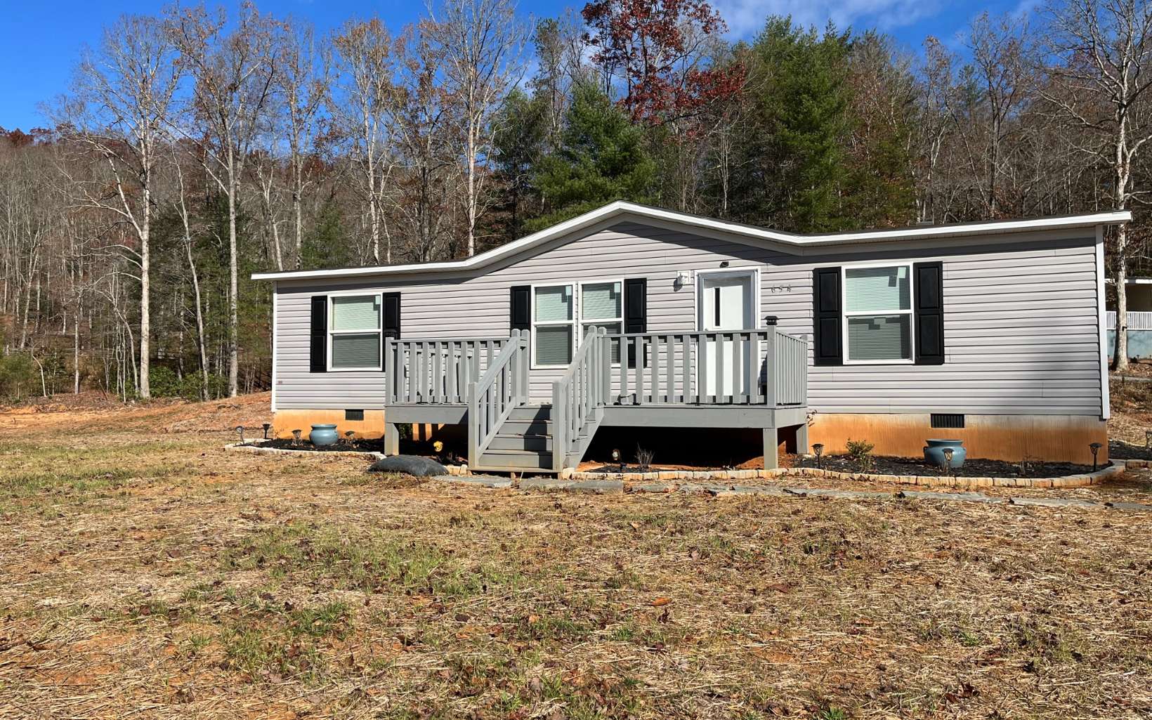 654 Burger Road Murphy, NC 28906 - Photo 33 of 33 a front view of a house with large trees and wooden fence