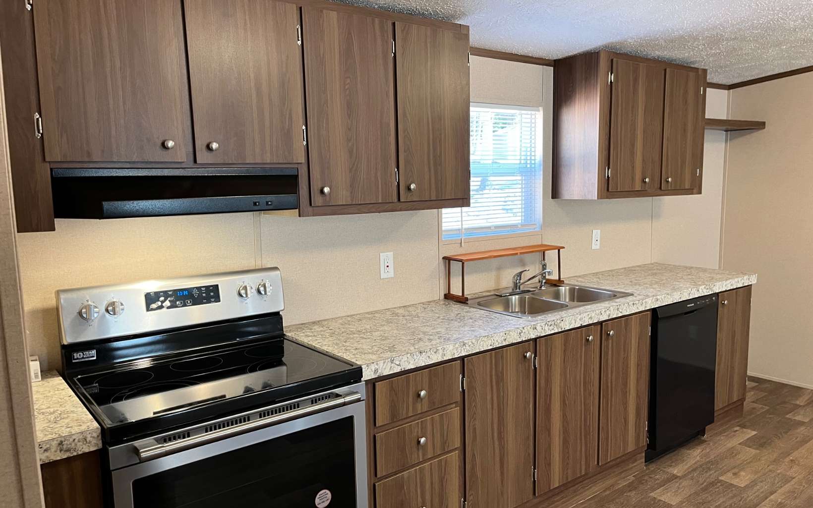 654 Burger Road Murphy, NC 28906 - Photo 6 of 33 a kitchen with a sink stove and cabinets