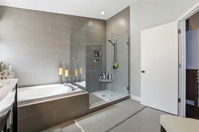 a bathroom with a bathtub and a sink