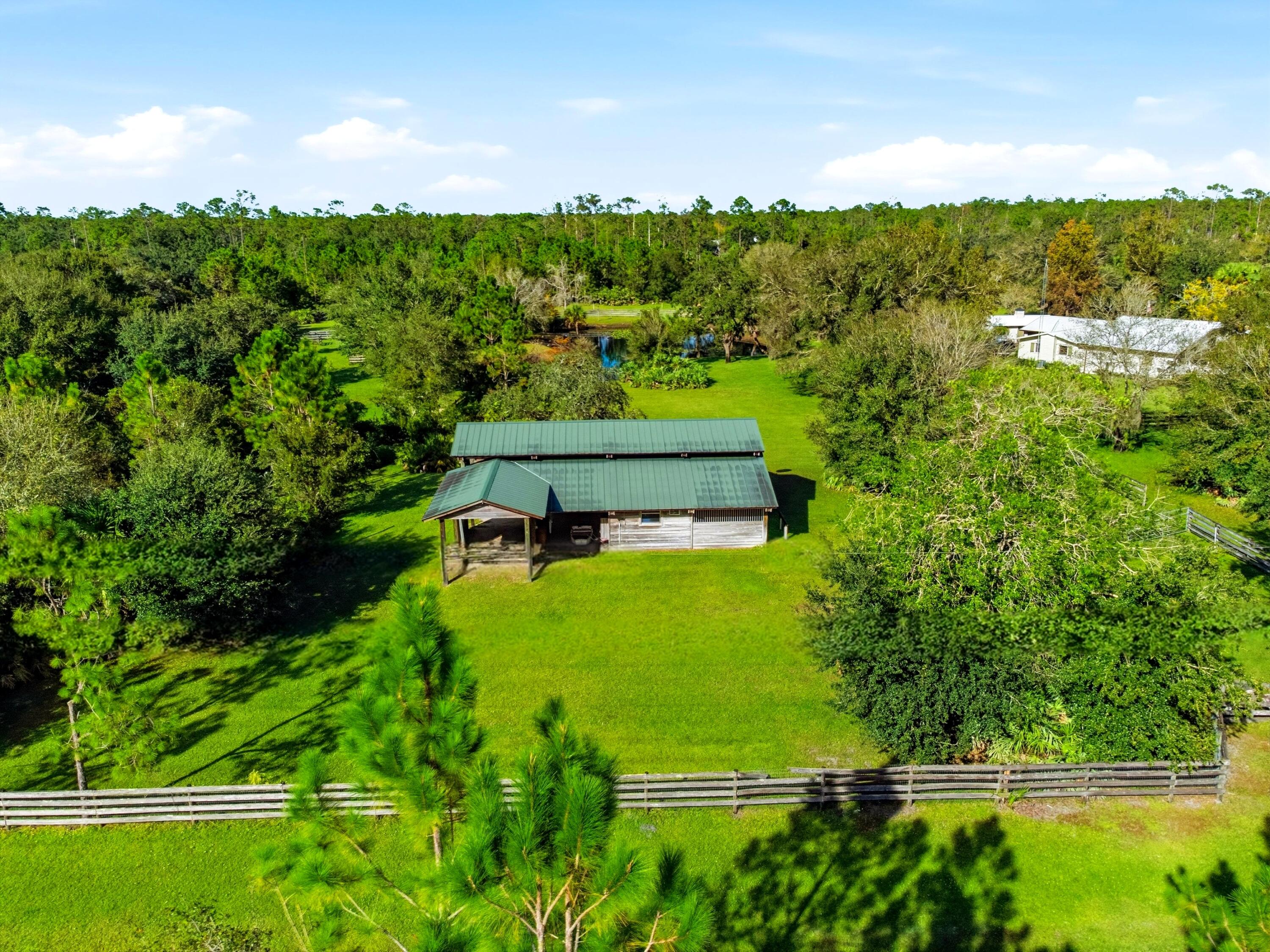 32801 Highway 441, Unit 64 Okeechobee, FL 34972 - Photo 58 of 138 a view of a garden with a building in the background