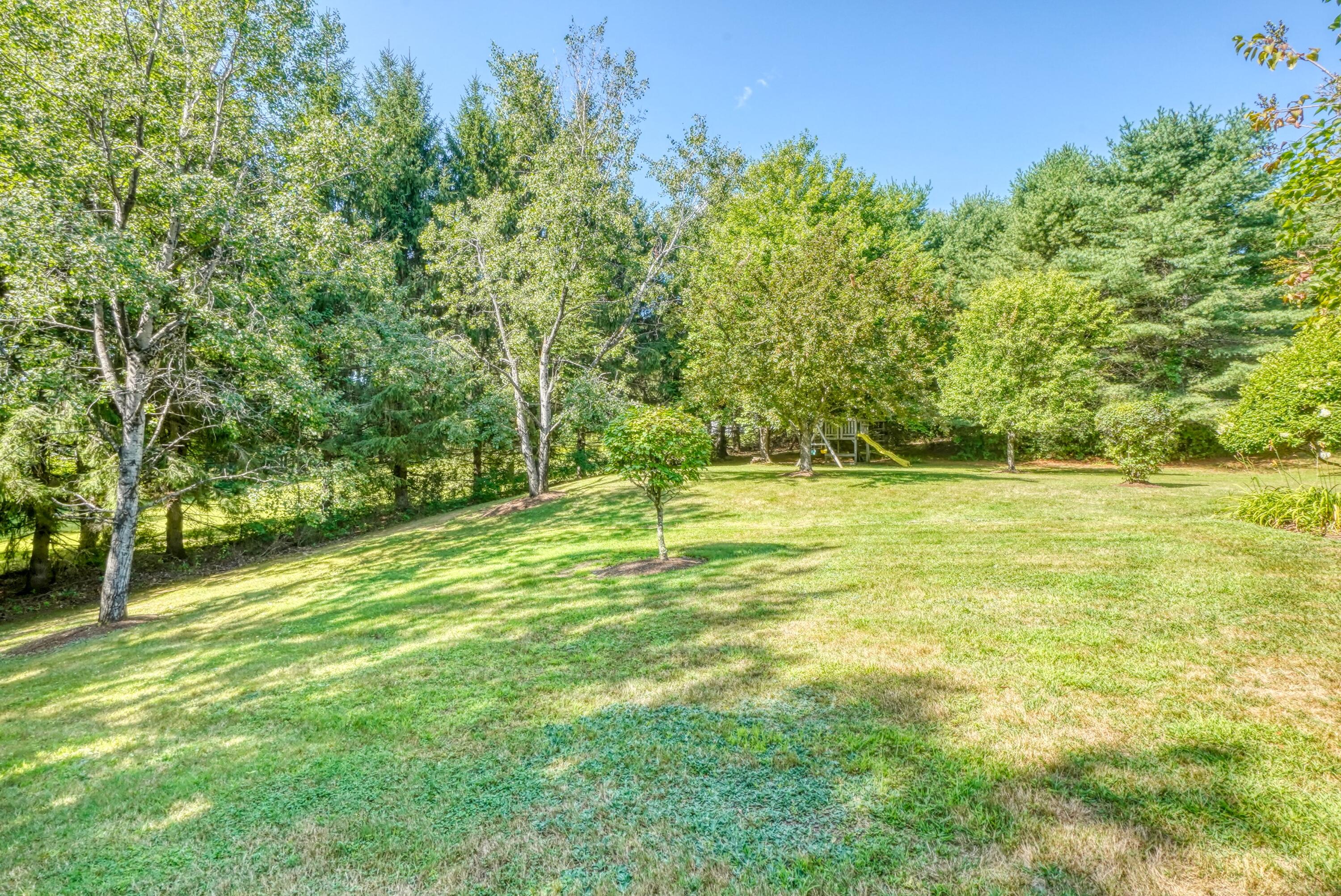 640 Neck Road China, ME 04358 - Photo 65 of 66 Yard with Paths into the Woods