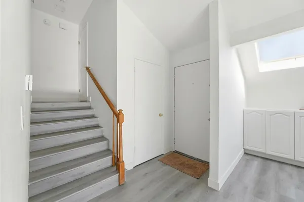 a view of entryway with wooden floor