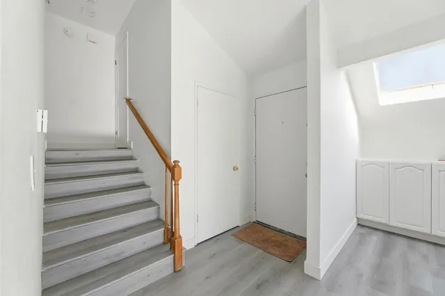 a view of entryway with wooden floor