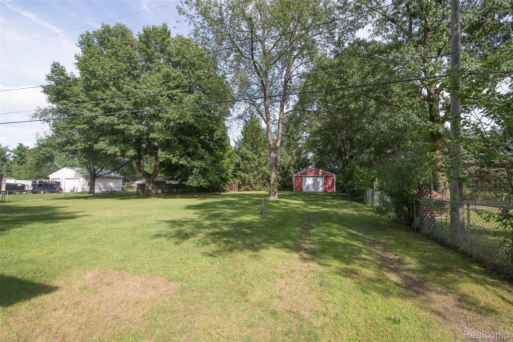 3250 Welch Road Walled Lake, MI 48390 - Photo 9 of 43 Back Yard with Pole Barn and Fenced