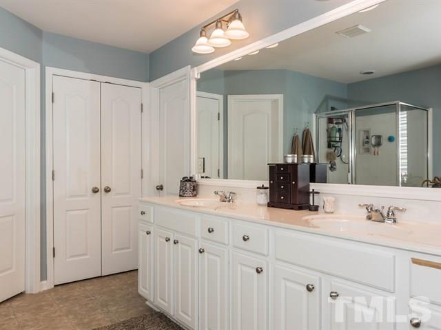 3319 Cathedral Bell Road Raleigh, NC 27614 - Photo 16 of 25 This master retreat is light and bright! Enjoy dual sinks with plenty of counter space and cabinets along with large storage closet!