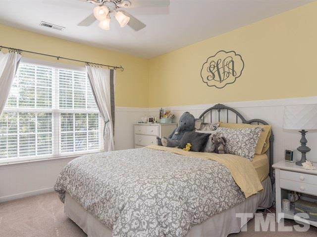 3319 Cathedral Bell Road Raleigh, NC 27614 - Photo 19 of 25 Upstairs bedroom with direct access to bathroom, walk-in closet and accented with beadboard walls. Freshly painted in neutral Repose Gray by Sherwin Williams.