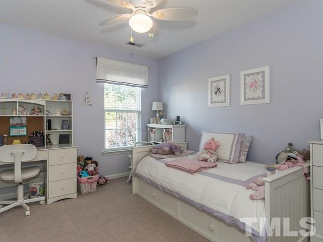 3319 Cathedral Bell Road Raleigh, NC 27614 - Photo 21 of 25 Third bedroom bedroom with walk-in closet now painted in the popular Mindful Gray color by Sherwin Williams.