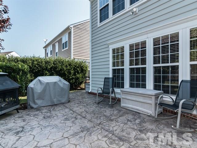 3319 Cathedral Bell Road Raleigh, NC 27614 - Photo 23 of 25 Stamped concrete patio off of the screened porch gives the grill master of the house an ideal place for chilling and grilling. There is also the perfect place for a fire pit for roasting marshmallows!