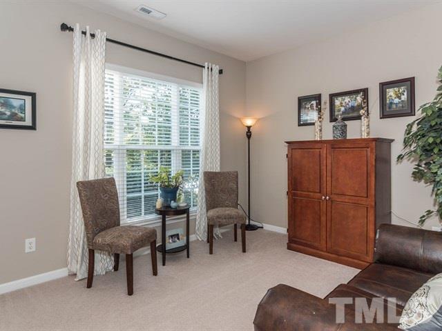 3319 Cathedral Bell Road Raleigh, NC 27614 - Photo 4 of 25 Formal living room offers that extra space you need for entertaining! It is also a great place to curl up on the couch with a good book!