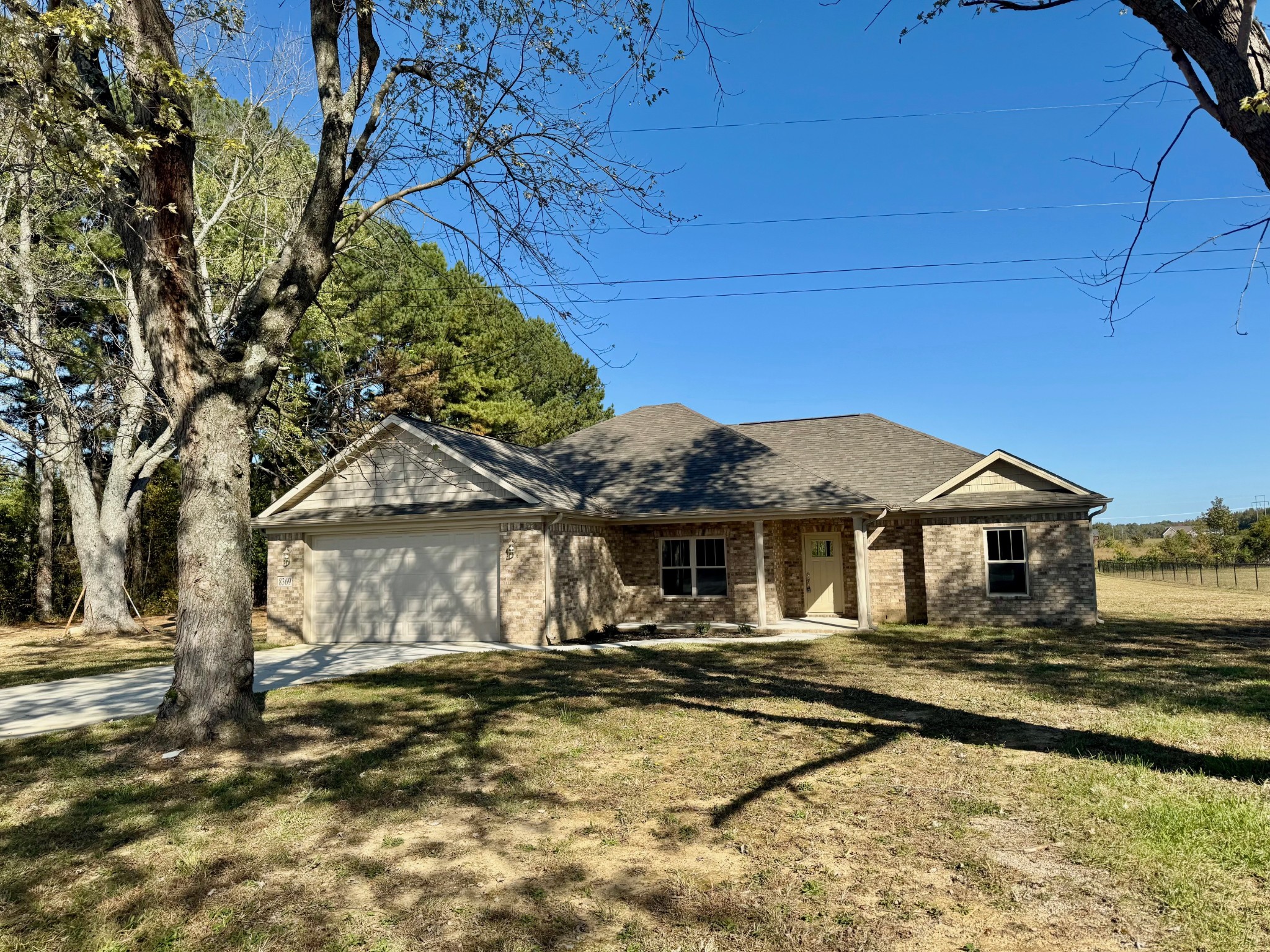 a front view of a house with a yard