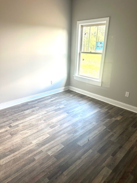8369 State Line Road Taft, TN 38488 - Photo 13 of 20 a view of an empty room with wooden floor and a window