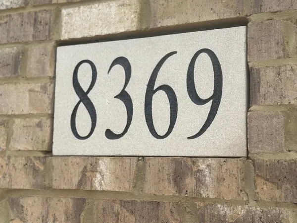 a close up of a brick wall with a stove