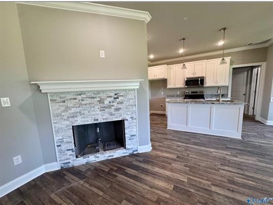 8369 State Line Road Taft, TN 38488 - Photo 8 of 22 a view of kitchen with granite countertop stove top oven and sink