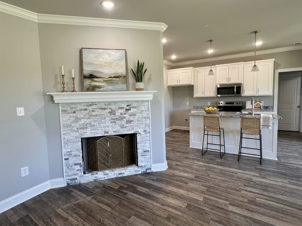 8369 State Line Road Taft, TN 38488 - Photo 9 of 25 a living room with furniture and a fireplace