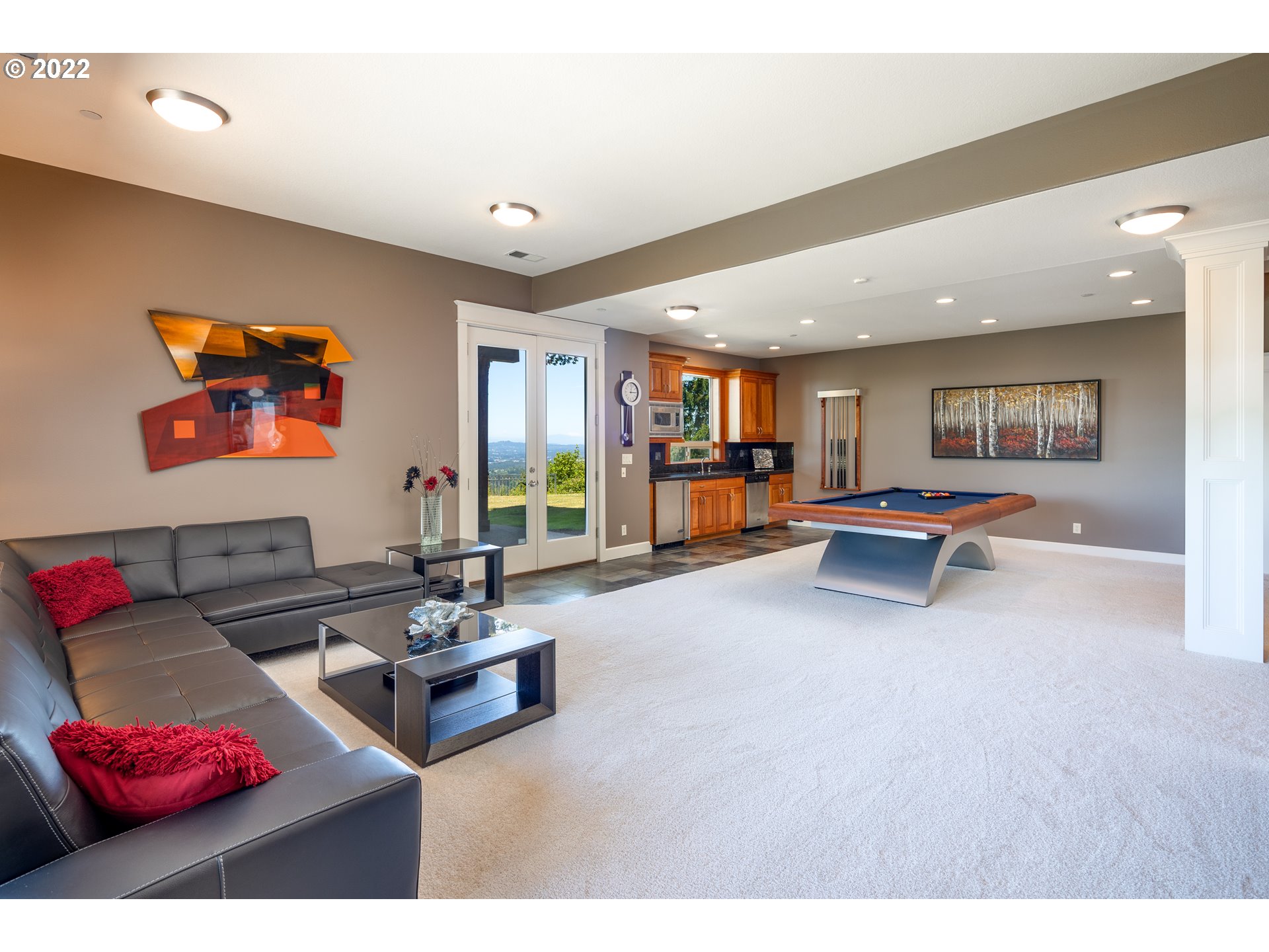26997 Southwest Labrousse Road Sherwood, OR 97140 - Photo 15 of 32 a living room with furniture and a flat screen tv