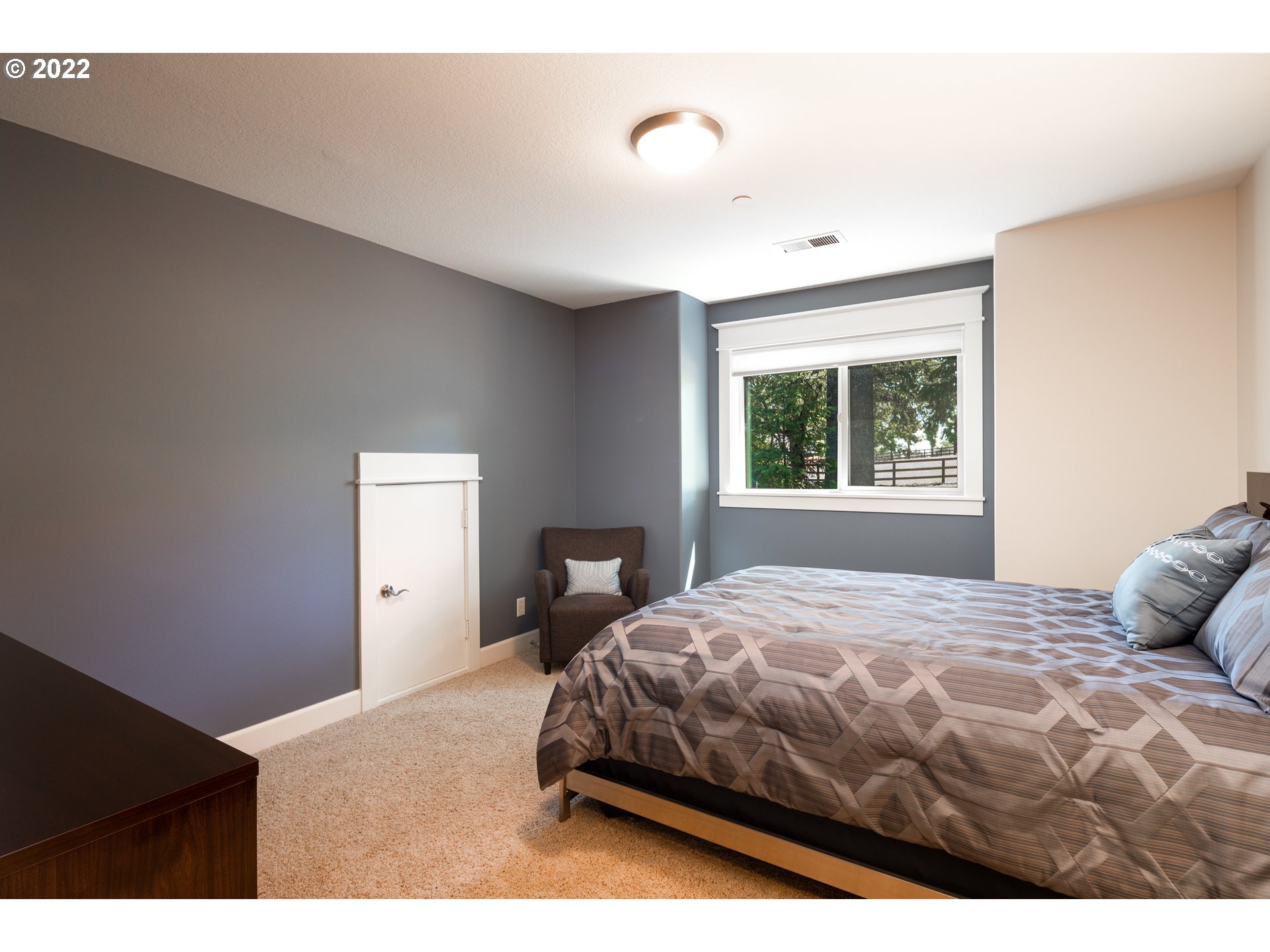 26997 Southwest Labrousse Road Sherwood, OR 97140 - Photo 24 of 32 a bedroom with a bed and a window
