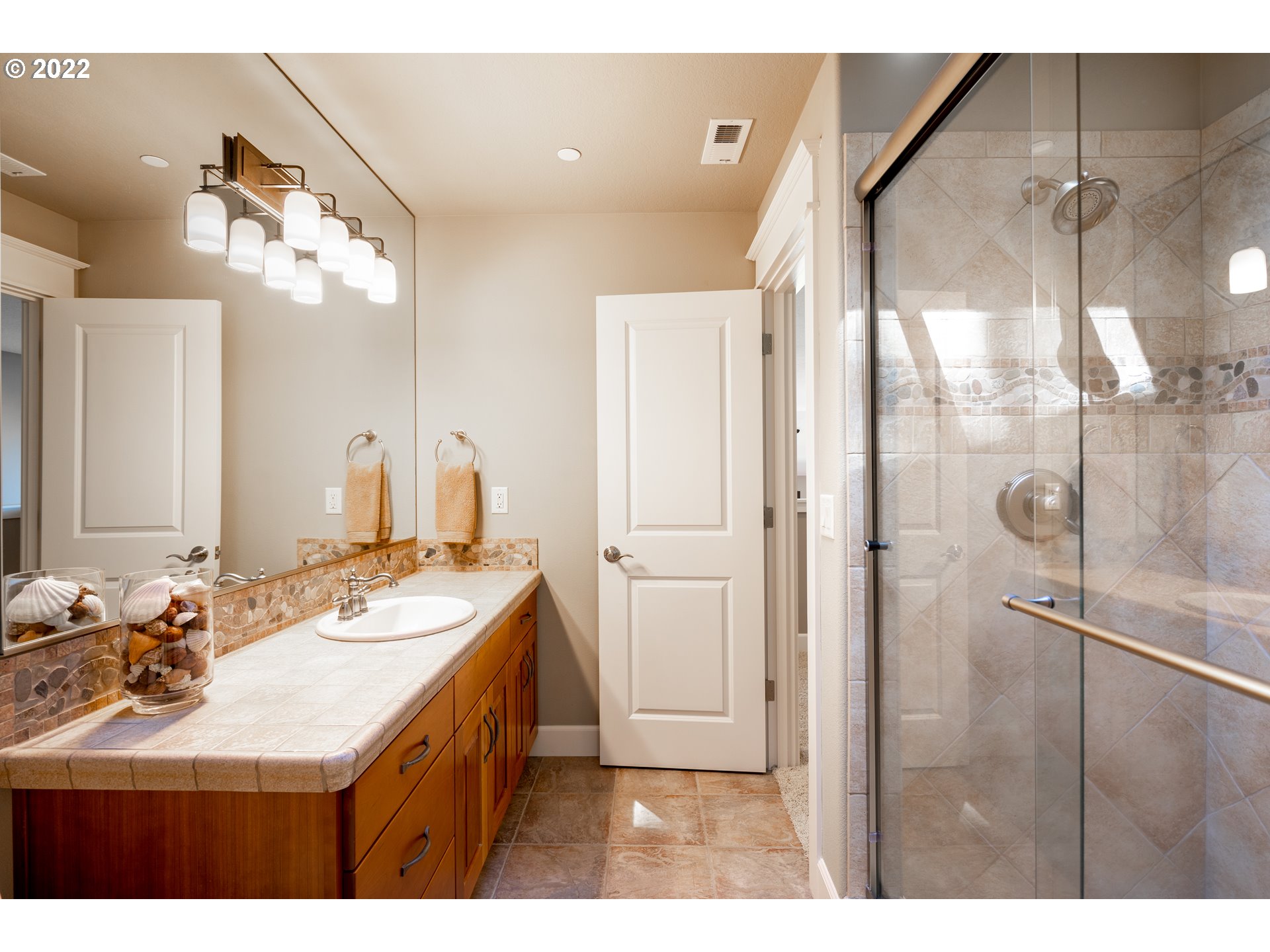 26997 Southwest Labrousse Road Sherwood, OR 97140 - Photo 27 of 32 a bathroom with a sink double vanity and a mirror