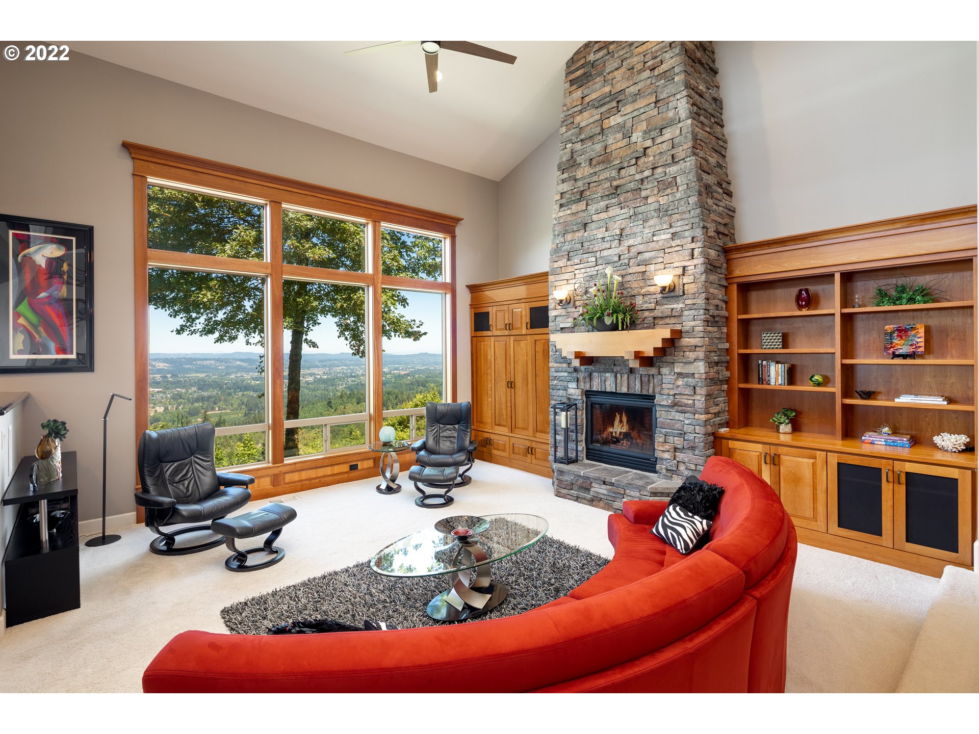 26997 Southwest Labrousse Road Sherwood, OR 97140 - Photo 7 of 32 a living room with furniture a fireplace and a flat screen tv