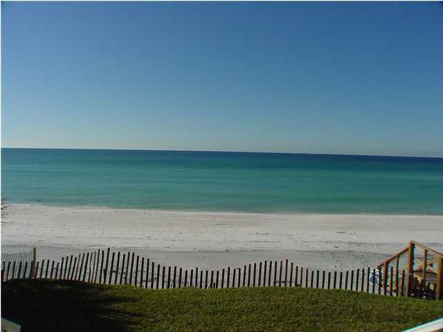6015 Highway Santa Rosa Beach, Unit A101 30A Santa Rosa Beach, FL 32459 - Photo 16 of 18 a view of a terrace with a yard