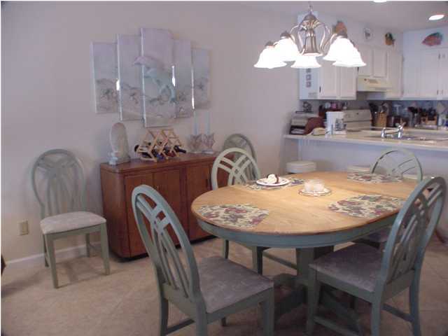 6015 Highway Santa Rosa Beach, Unit A101 30A Santa Rosa Beach, FL 32459 - Photo 3 of 18 a dining room with furniture and chandelier