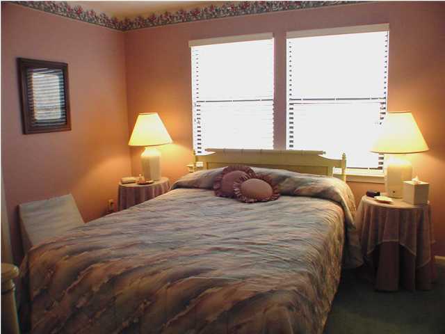 6015 Highway Santa Rosa Beach, Unit A101 30A Santa Rosa Beach, FL 32459 - Photo 6 of 18 a bedroom with a bed and a window