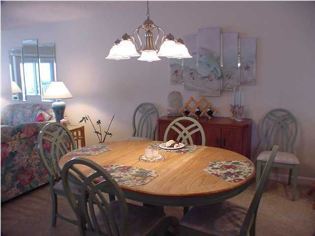 6015 Highway Santa Rosa Beach, Unit A101 30A Santa Rosa Beach, FL 32459 - Photo 10 of 18 a view of a dining room with furniture