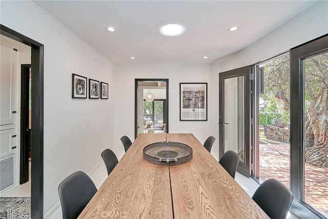a kitchen with stainless steel appliances granite countertop a sink and cabinets