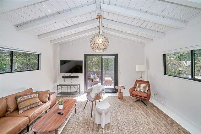 swimming pool with outdoor seating and green space