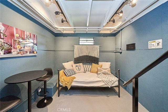 a bathroom with a sink a glass door shower and a mirror