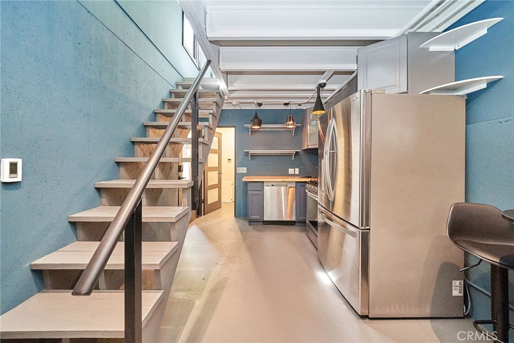 8457 Ridpath Drive Los Angeles, CA 90046 - Photo 25 of 33 a view of entryway and kitchen with wooden floor