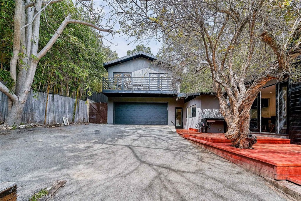 8457 Ridpath Drive Los Angeles, CA 90046 - Photo 29 of 33 a front view of a house with a yard