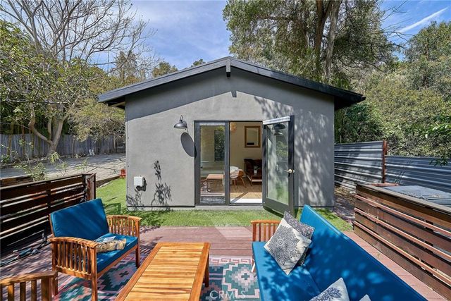 a view of backyard with outdoor seating