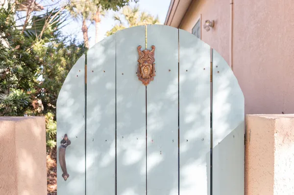 a dining room with furniture entryway and wooden floor