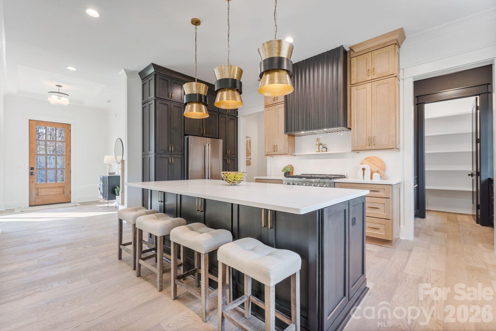 636 American Bittern Way Clover, SC 29710 - Photo 11 of 41 a large kitchen with a table and chairs