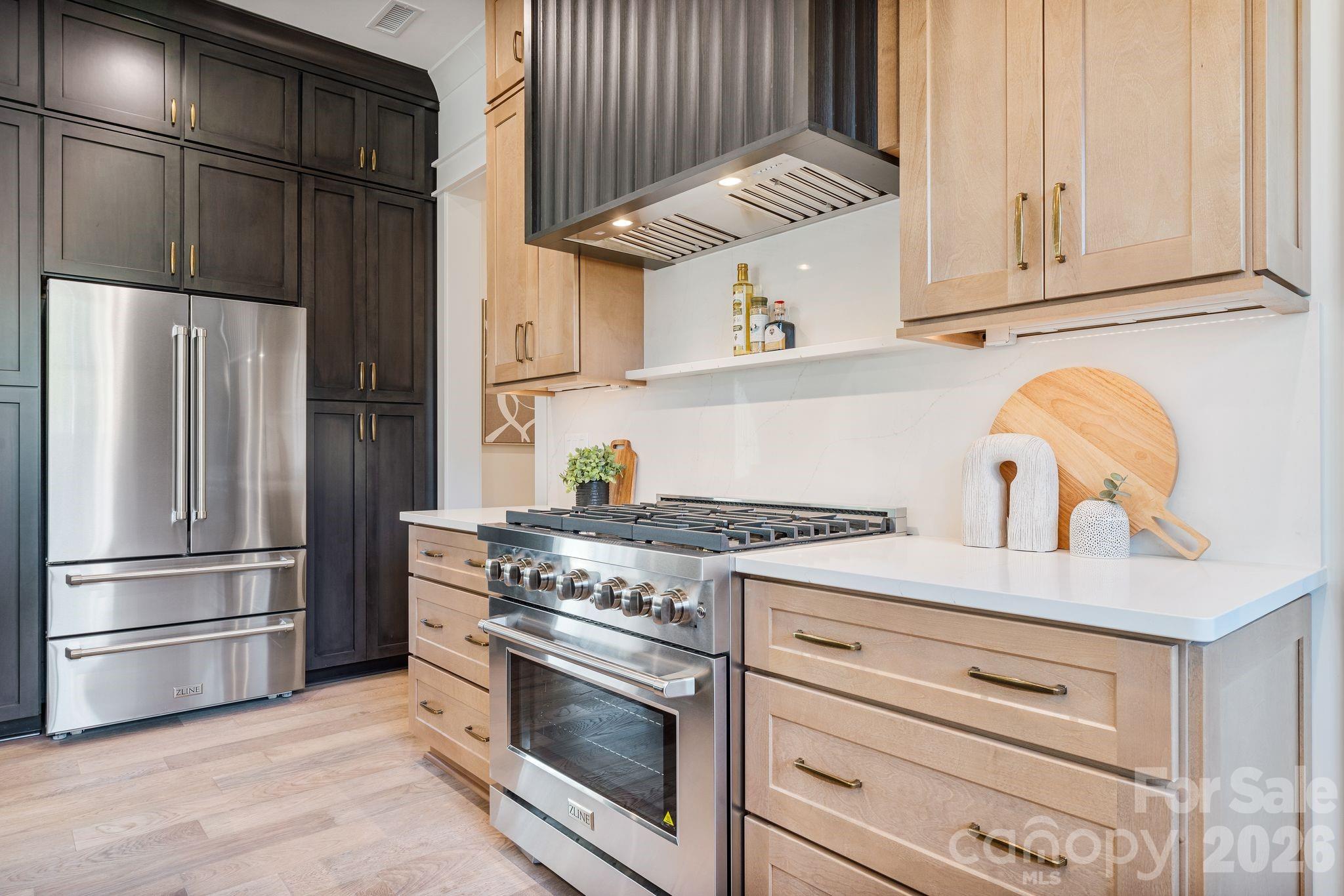 636 American Bittern Way Clover, SC 29710 - Photo 13 of 41 a kitchen with granite countertop white cabinets and stainless steel appliances