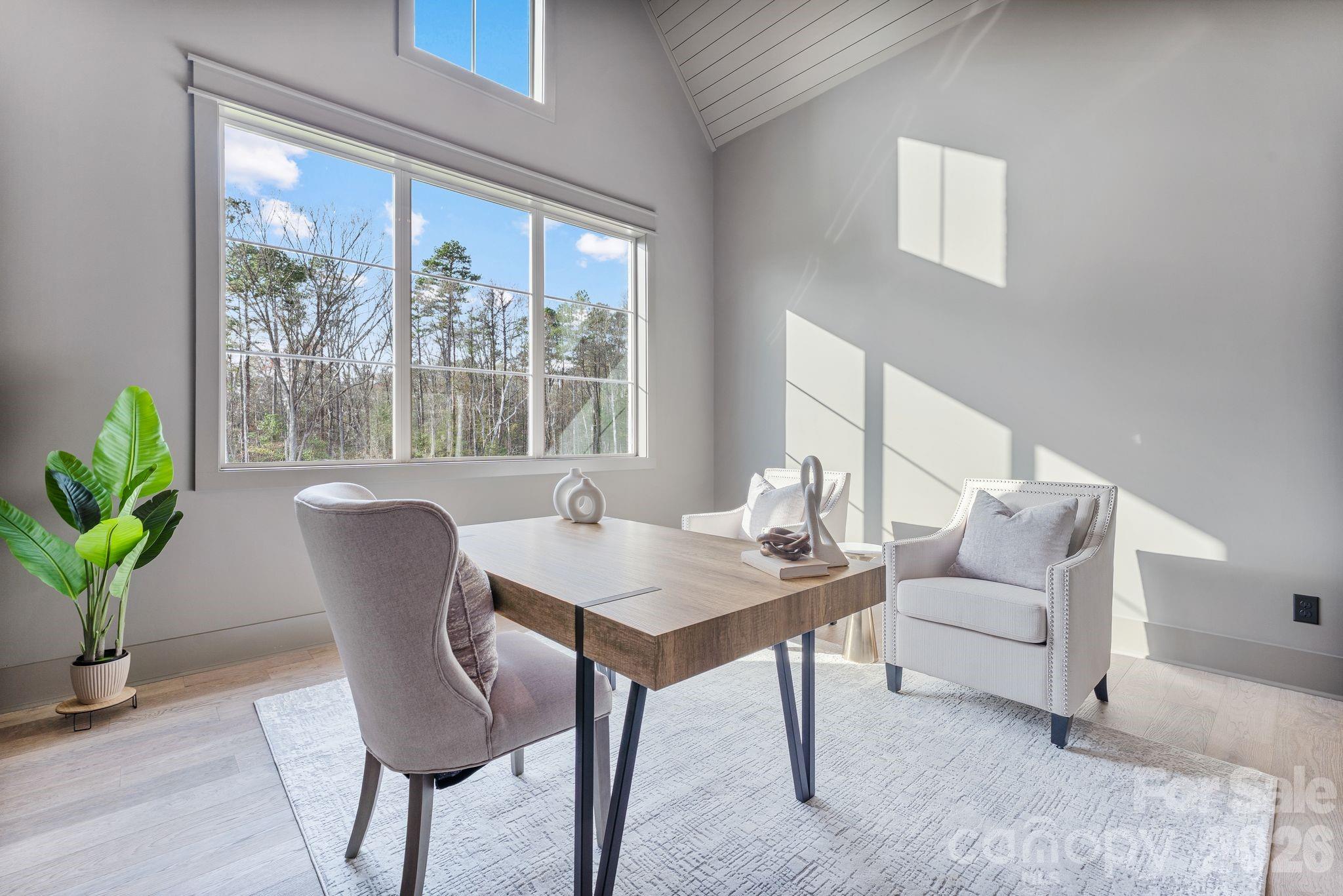 636 American Bittern Way Clover, SC 29710 - Photo 21 of 41 a view of a dining room with furniture window and wooden floor