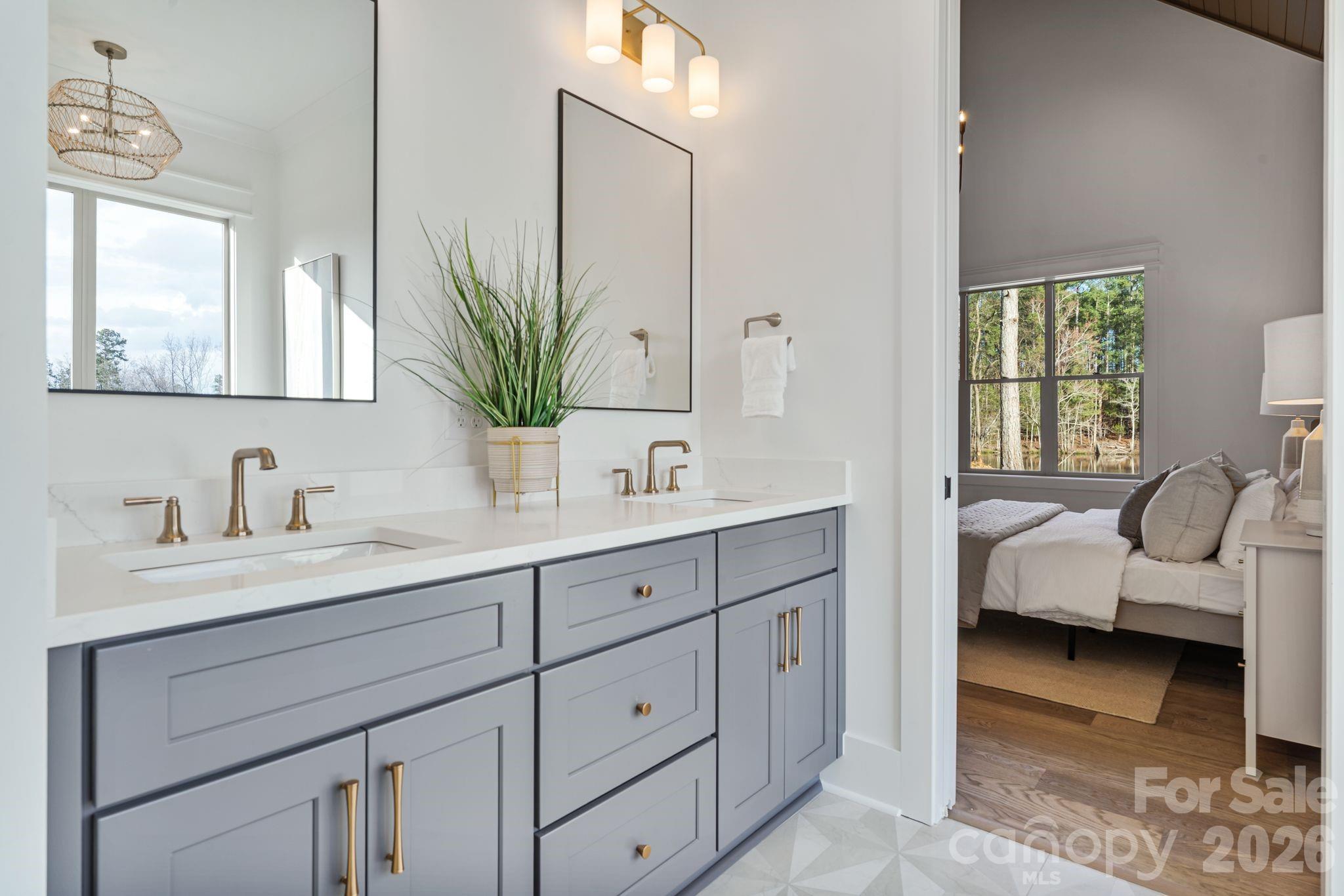 636 American Bittern Way Clover, SC 29710 - Photo 23 of 41 a en suite bathroom with double sink and a mirror