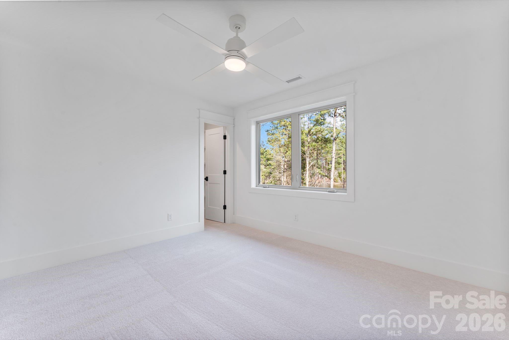 636 American Bittern Way Clover, SC 29710 - Photo 34 of 41 an empty room with windows and ceiling fan
