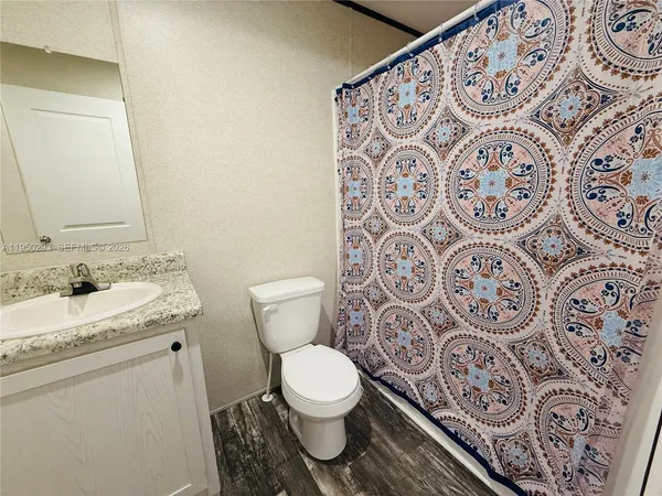 a bathroom with a toilet and a sink