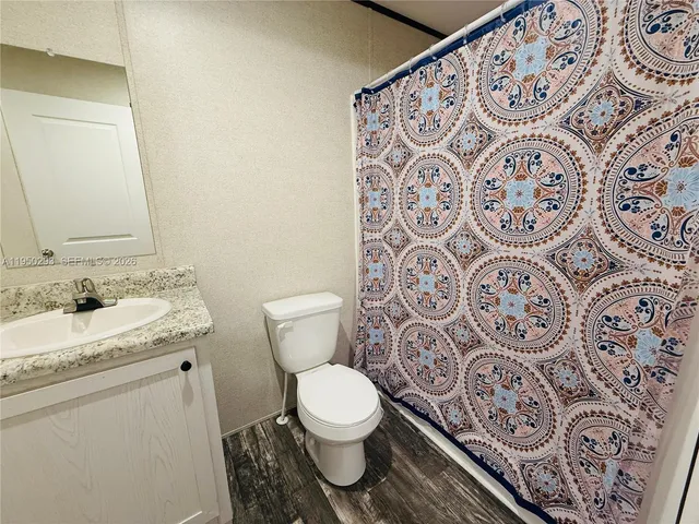 a bathroom with a toilet and a sink